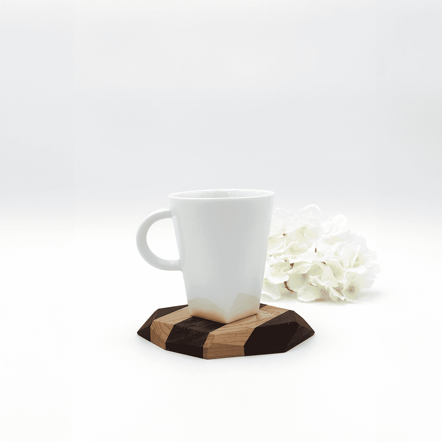 Wooden coaster with black walnut and maple, white mug, white flowers