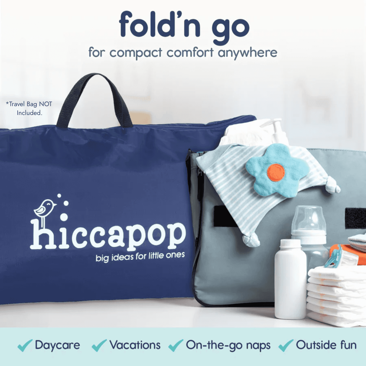 Nappy bag with baby items and hiccapop branding on a white background