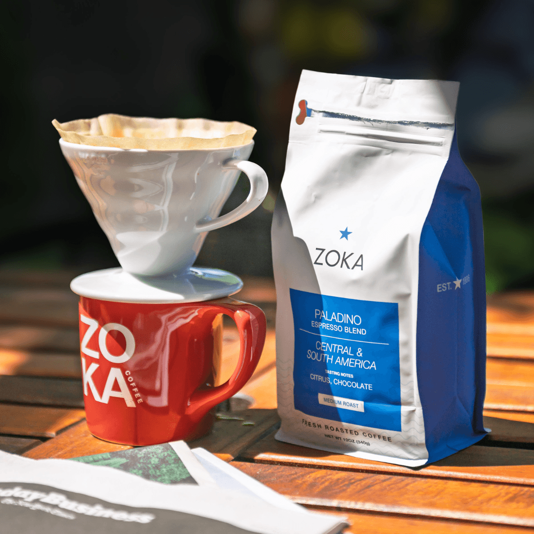 Zoka Paladino coffee bag next to brewed coffee in a cup with pour-over filter for food and beverages category