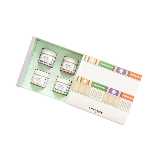 Kinapure Whipped Shea Butter Gift Box 4 Pack 2oz Body Butter Set featuring four moisturizing jars in a colorful, patterned gift box.