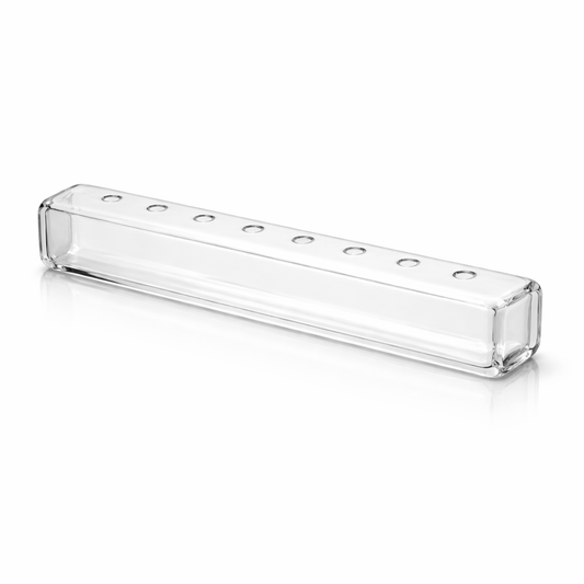 Clear glass rectangular vase by Ashland with multiple small holes for flowers on a white background