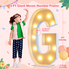 Child next to a large illuminated letter 'G' with decorative elements on a pink background