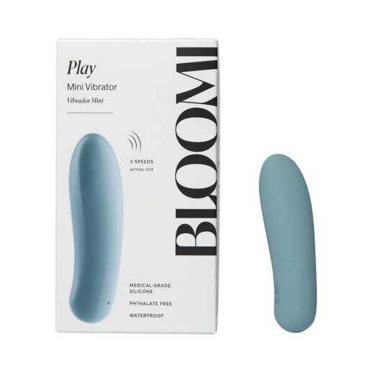 Bloomi Play Waterproof Rechargeable Mini Vibrator in teal shown next to its retail packaging, highlighting compact size and 3-speed settings.