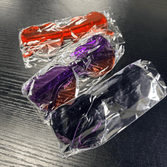 Individually wrapped Kids Heart Sunglasses in orange, purple, and black gradient colors, ideal for party favors or goodie bags.