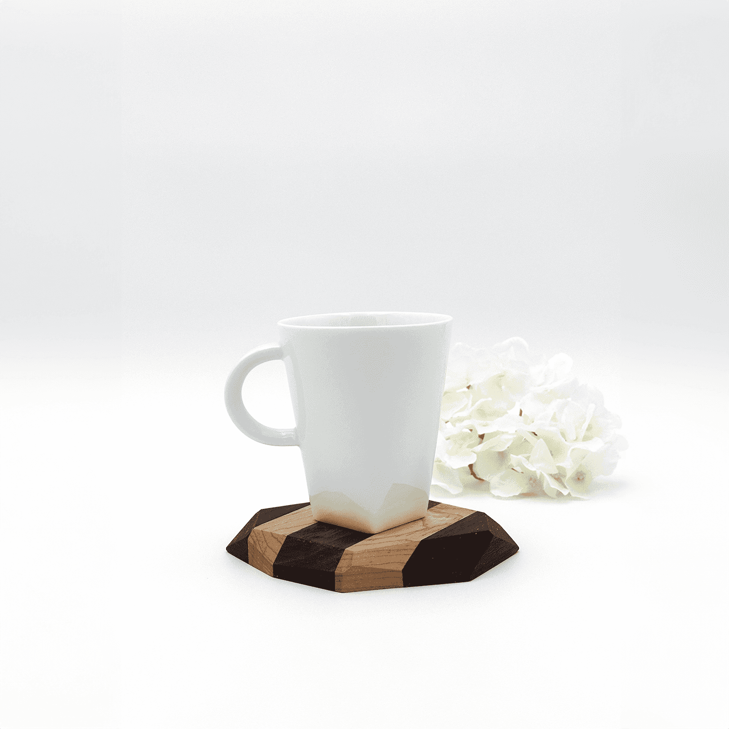 Wooden coaster with black walnut and maple, white mug, white flowers