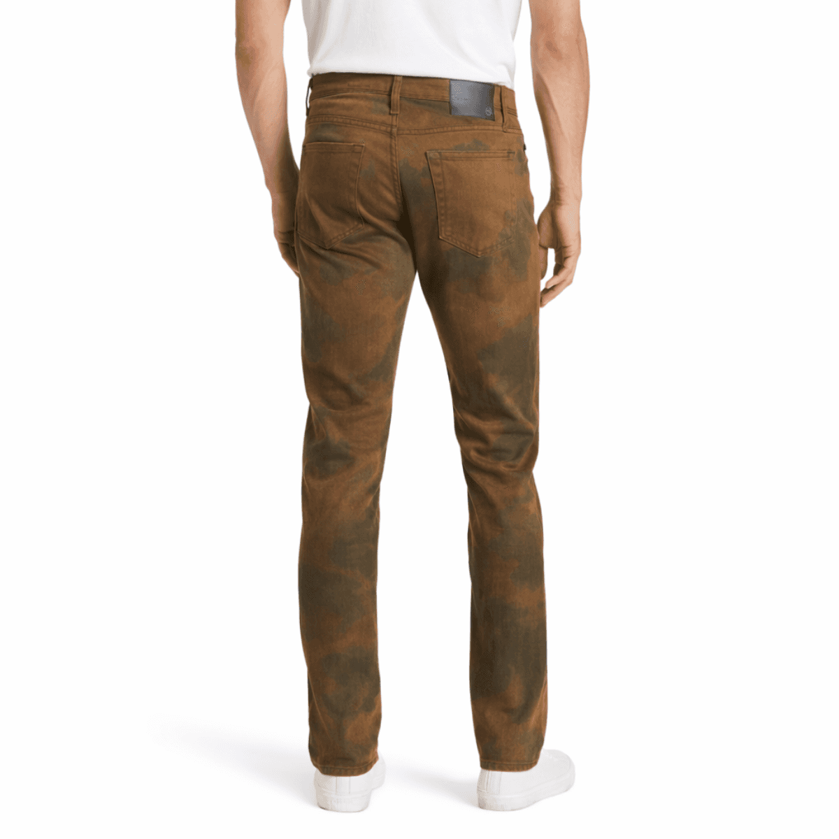 Brown AG jeans worn by a model on a white background