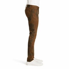 Brown AG jeans worn by a model on a white background