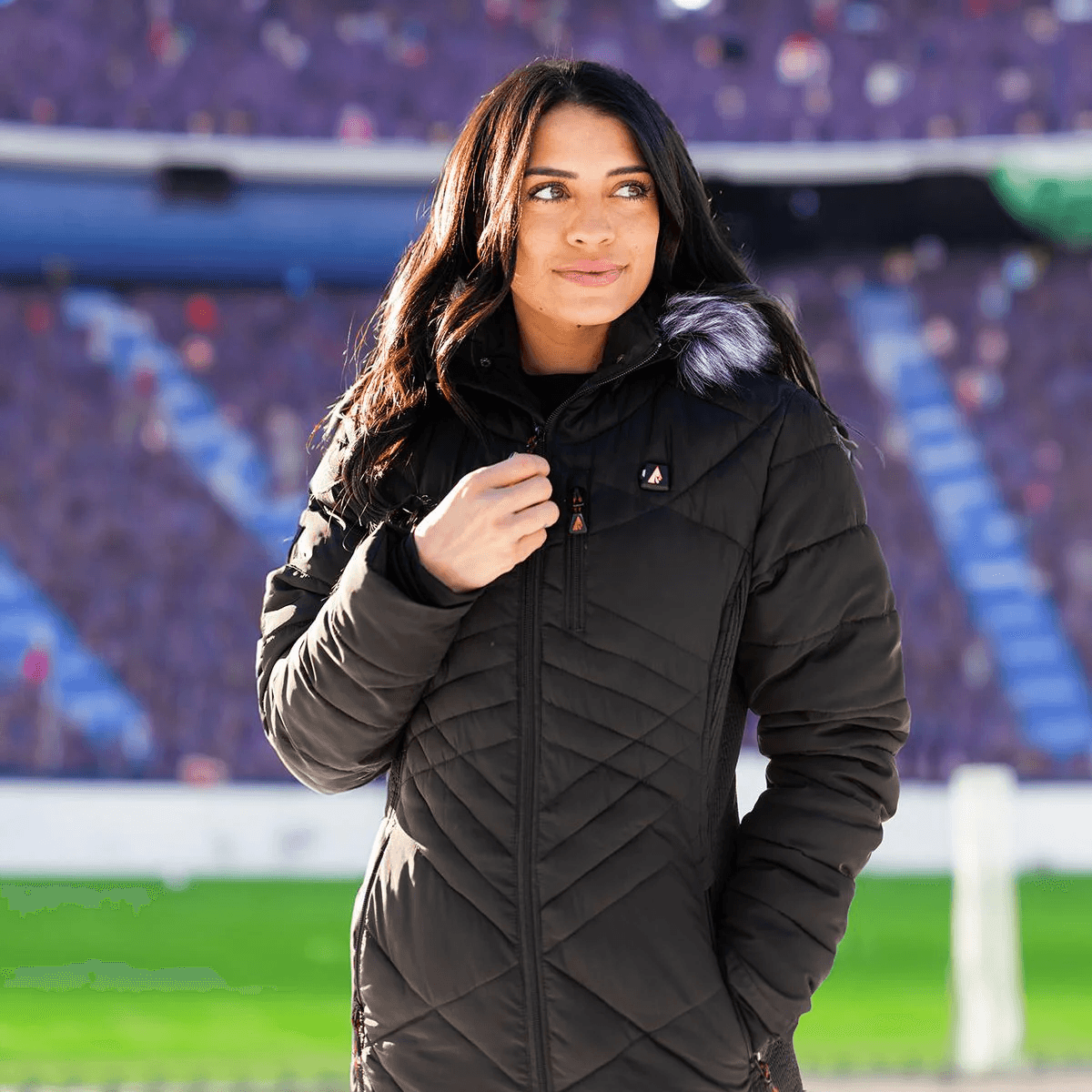 Infographic of heated jacket features with woman in black jacket