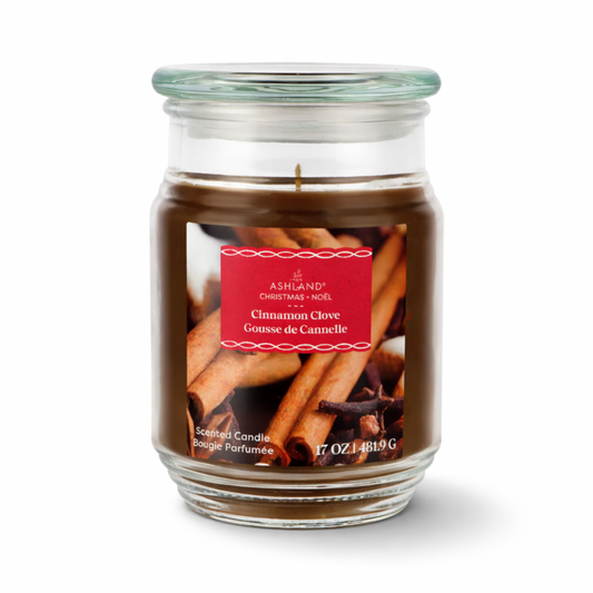 Glass candle jar from Ashland labeled 'Cinnamon Clove' on a white background