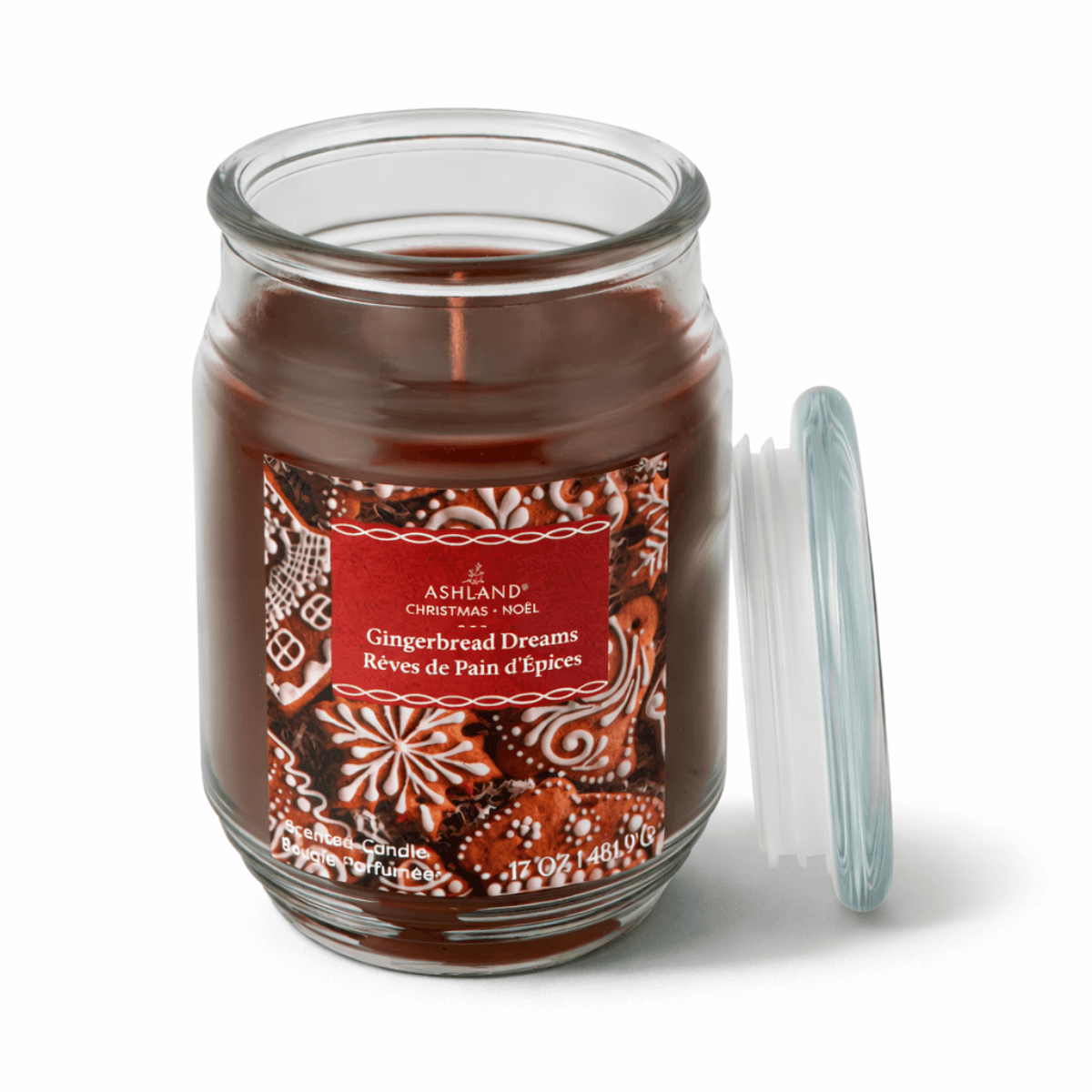 Glass jar candle with gingerbread design, labeled 'Gingerbread Dreams' on a white background