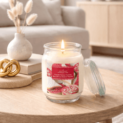 Lit Vanilla Butter Cookies scented candle in glass jar on living room table