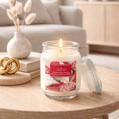 Lit Vanilla Butter Cookies scented candle in glass jar on living room table