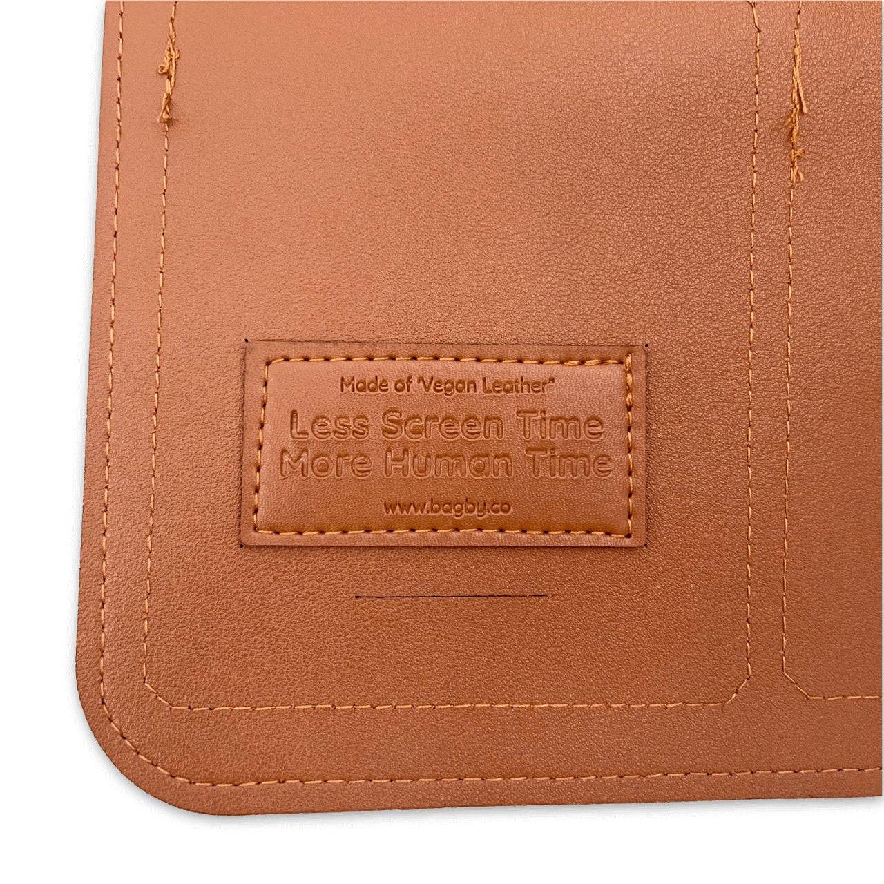 Brown vegan leather product with a label on a white background
