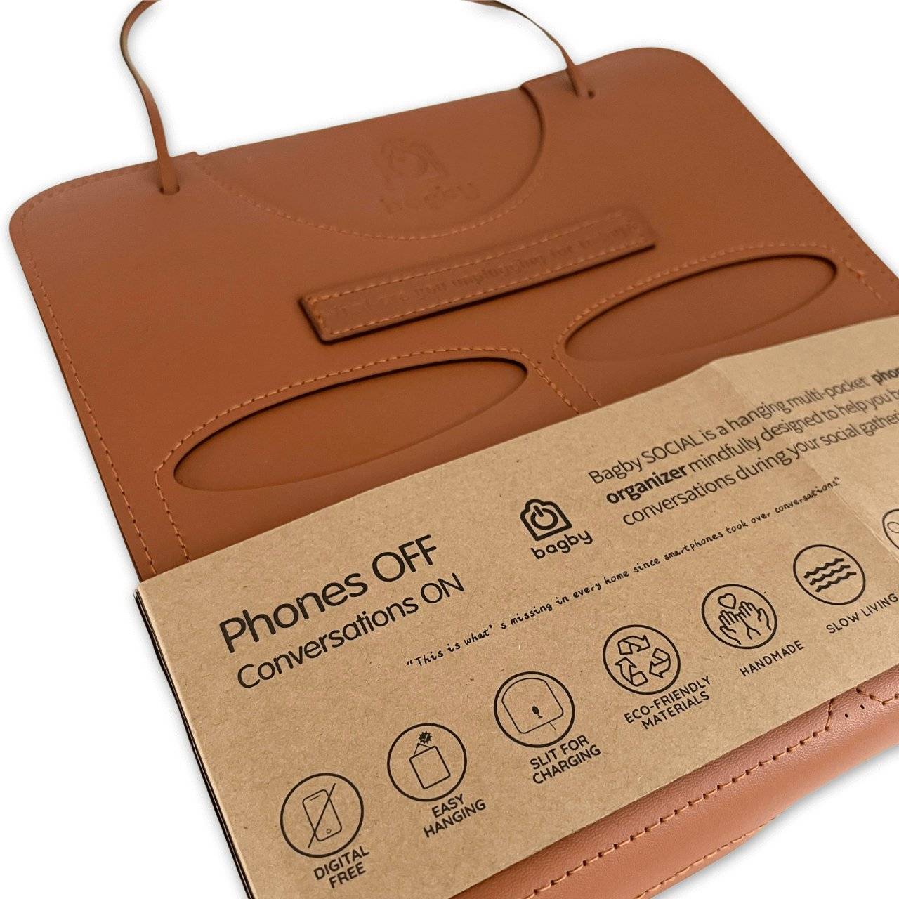 Brown leather organizer with a cardboard label on a white background