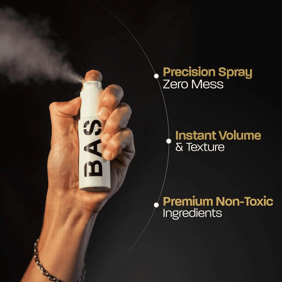 Hand holding spray bottle with styled hair