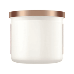 Unlit candle with rose gold lid and blank white jar for home decor