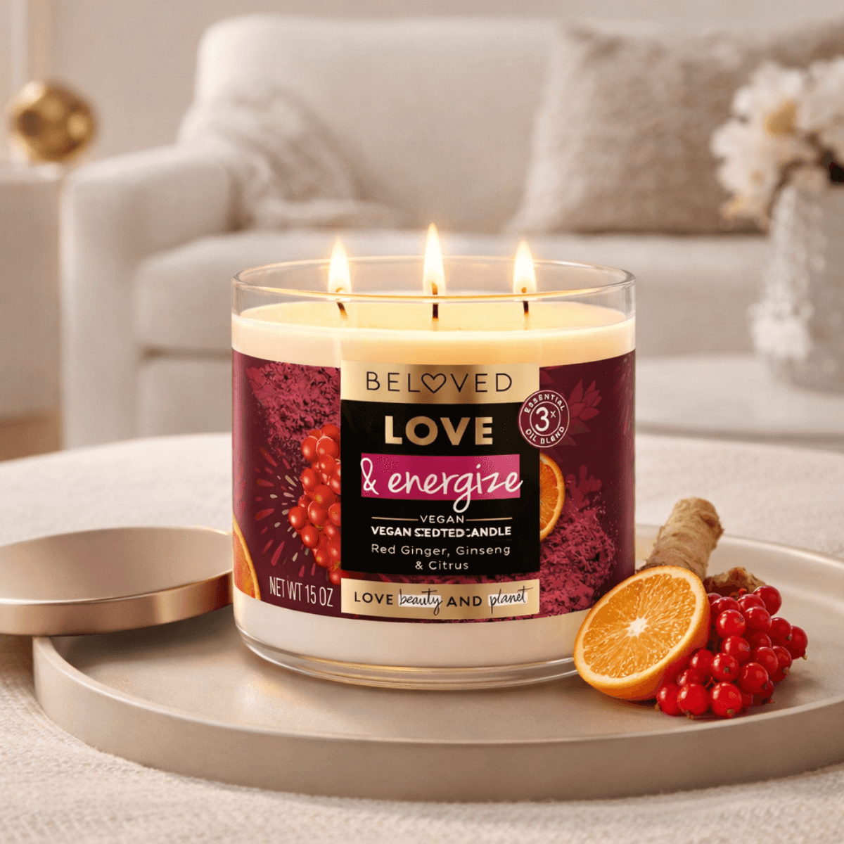 Lit candle with orange slices, red berries, and a cozy background setting
