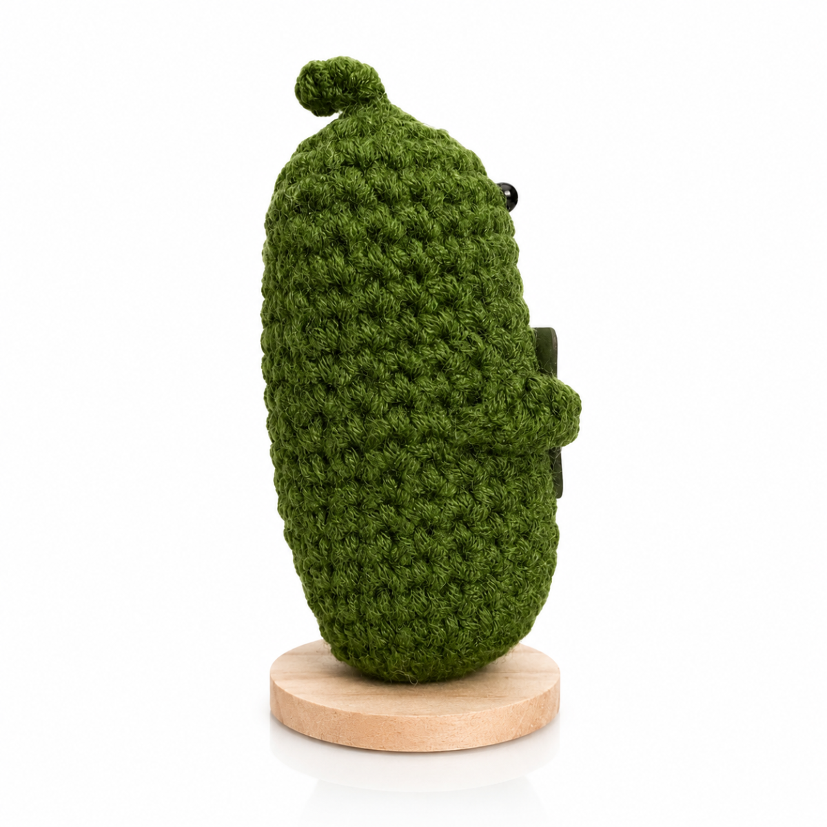 Green fuzzy plush emotional support pickle figure with black bead eyes on wooden stand, Deal Seeker Collection, 4.5 in