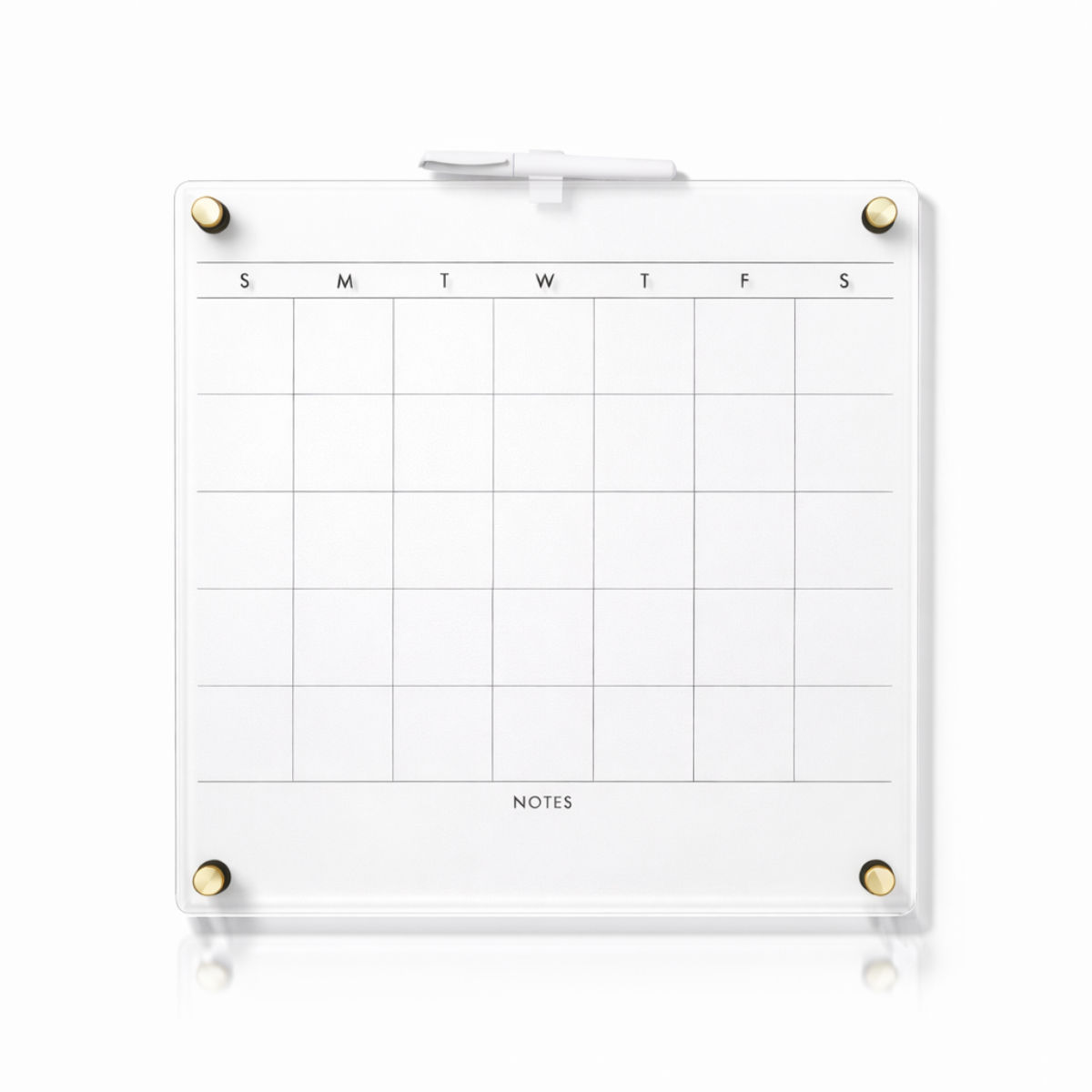 Clear acrylic dry erase calendar with white surface and gold magnets for office organization