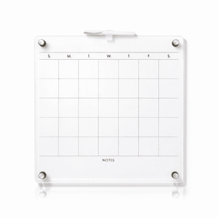 Clear acrylic dry erase calendar with white surface and gold magnets for office organization
