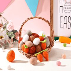 Wicker basket with felt Easter eggs and carrots on a colorful background