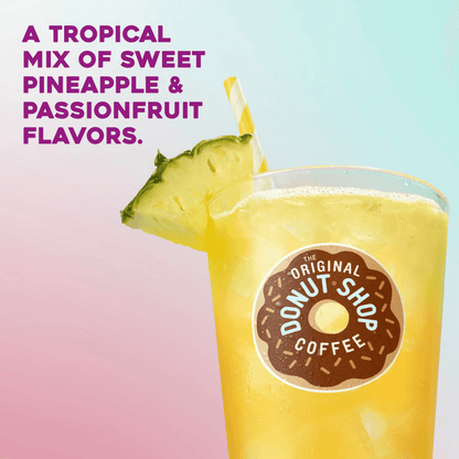 Pineapple Passionfruit Iced Drink with pineapple slices and straw