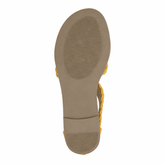 Close-up of a sandal sole by Journee Collection with Mustard color straps on a white background