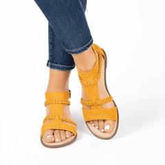 Women modeling the Journee Collection Florence Mustard sandals.