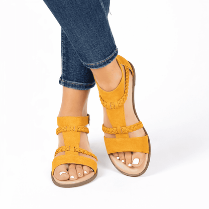 Women modeling the Journee Collection Florence Mustard sandals.