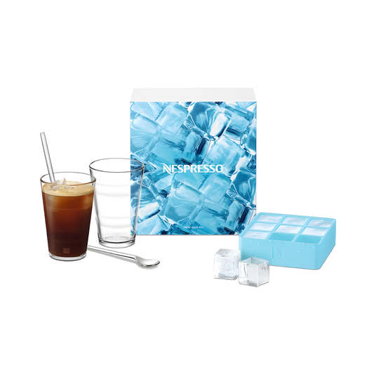 Nespresso View Iced Coffee Glass Set with two tempered glasses, metal spoons, and blue ice tray in front of branded packaging. Ideal for home café drinks.