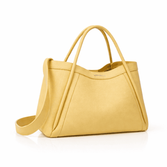 Yellow handbag on marble table with sunglasses and soft fabric, elegant setting, Newbella branding