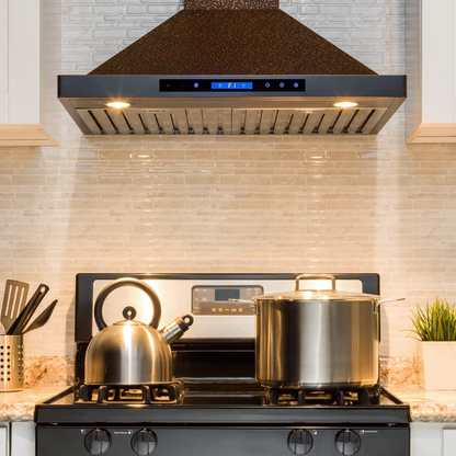 Stove with pots and a kettle in a kitchen setting