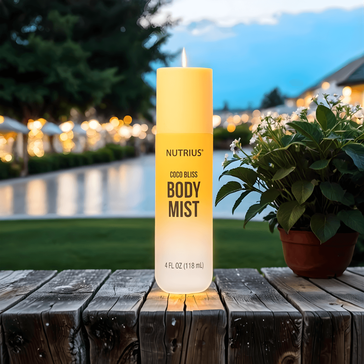 Nutrius Coconut Body Mist Spray Coco Bliss 4 oz on wooden table at sunset, perfect for evening wear with a soft, tropical aroma.