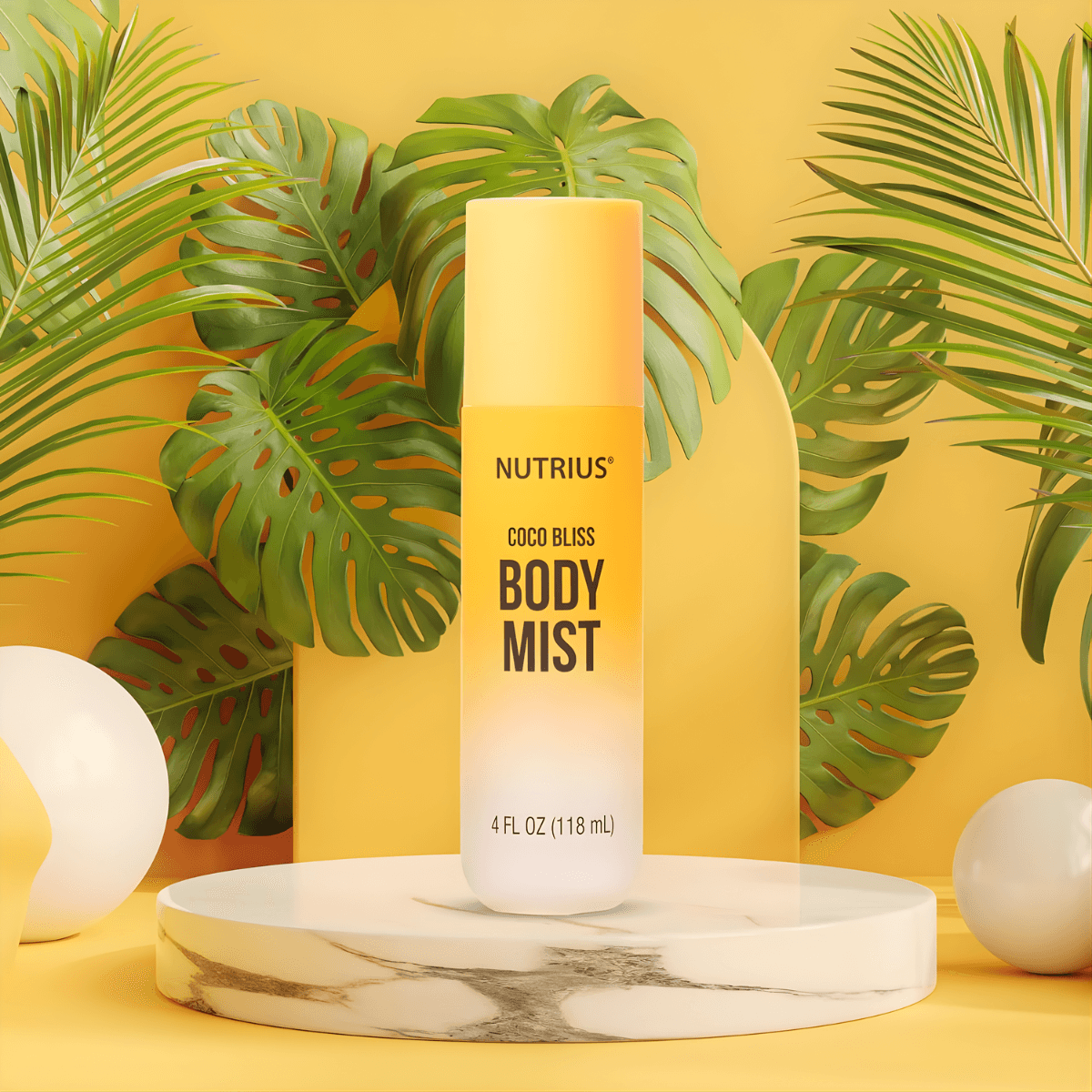 Nutrius Coco Bliss Body Mist spray on marble stand with tropical leaves