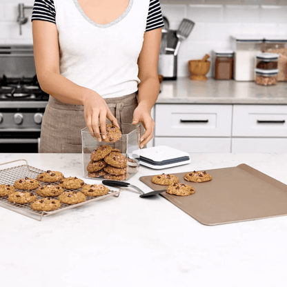 Cookies stored in a clear airtight container with a lid