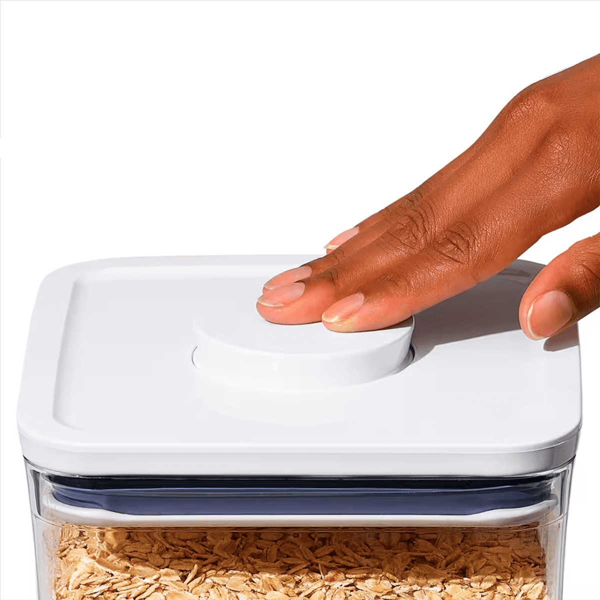 Hands opening a white airtight food storage container lid