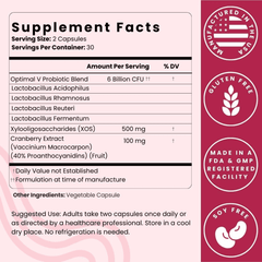 Supplement label with ingredients and manufacturing details on a pink background