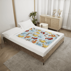 Bed with a colorful dragon themed blanket by Regal Comfort in a bedroom setting.