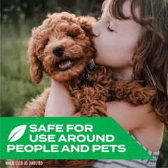 Child kissing a brown dog with a green safety label at the bottom.