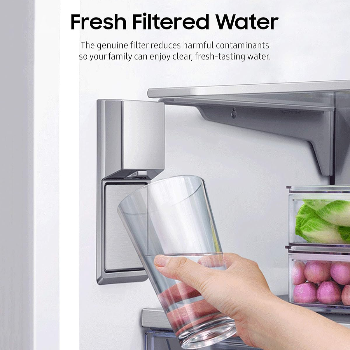A hand holding a clear glass under a stainless steel water filter dispenser inside a refrigerator, with text at the top reading 'Fresh Filtered Water.'.