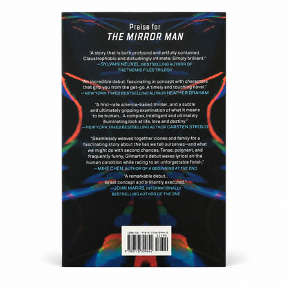 Hardcover book in black with colorful abstract cover art, MIRA The Mirror Man, ISBN barcode on back cover sticker label