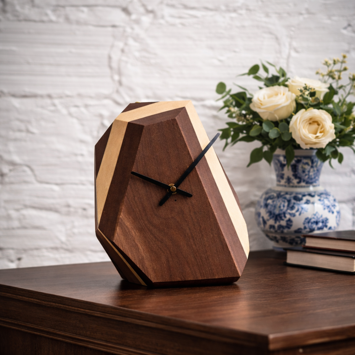Wooden clock on a wooden surface with a vase of flowers in the background