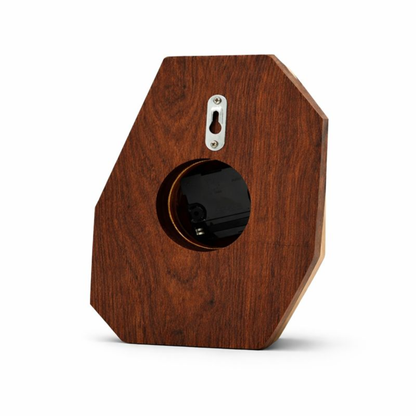 Back side of a modern wood clock on a white background