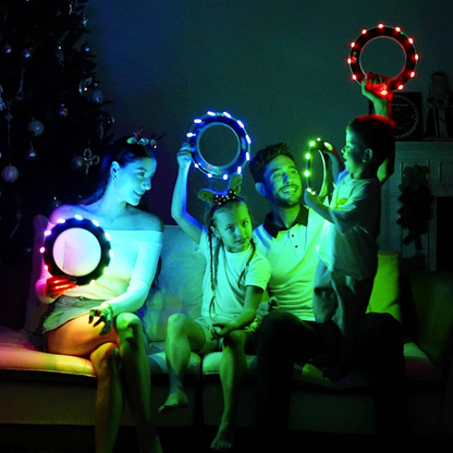 Family playing with TOSY Flying Rings in a dark room