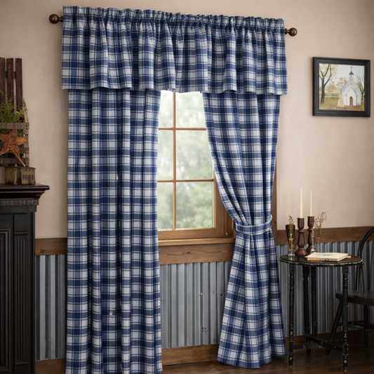 Blue and white plaid curtains in a room with a window and decor elements.