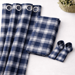 Blue and white plaid curtains with grommets on a light background