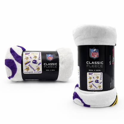 Minnesota Vikings Classic Fleece Throw Blanket rolled with NFL logo label, featuring team graphics in purple and gold. Ideal for home or game day use.