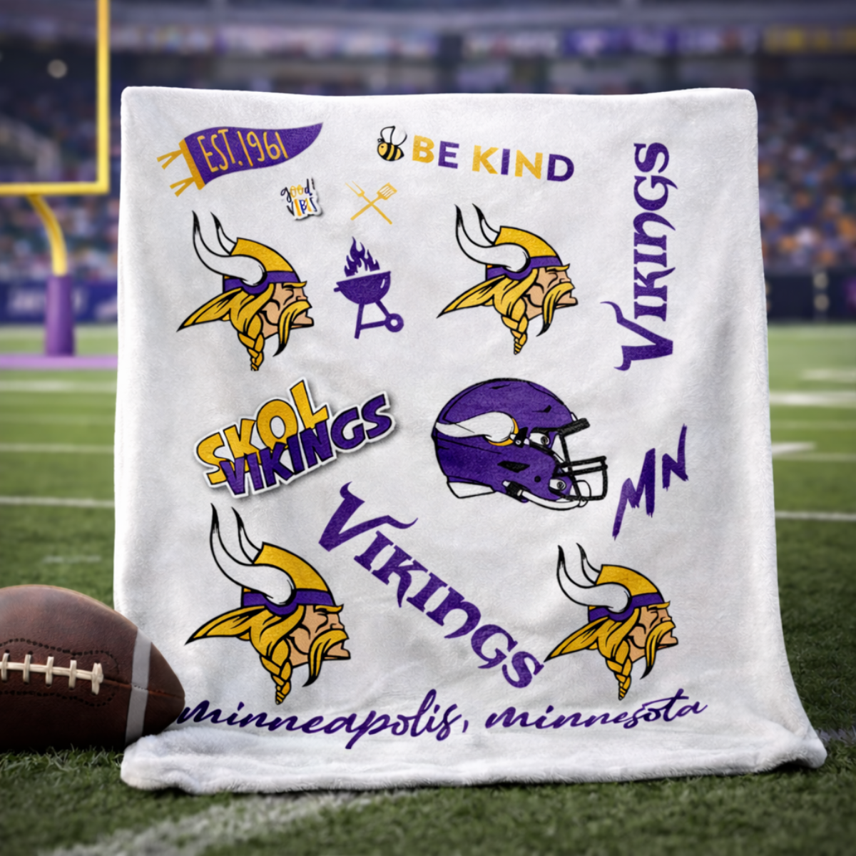 Minnesota Vikings Classic Fleece Throw Blanket featuring team logos, helmet, and slogans like 'SKOL' and 'Be Kind' on a white background. Ideal for home or game day comfort.